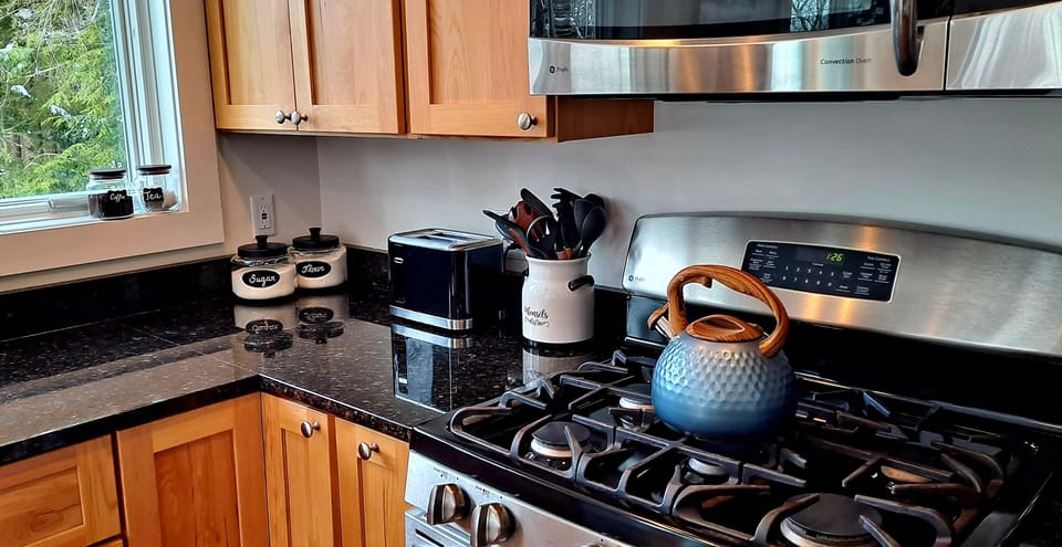 Open kitchen with island facing dining room