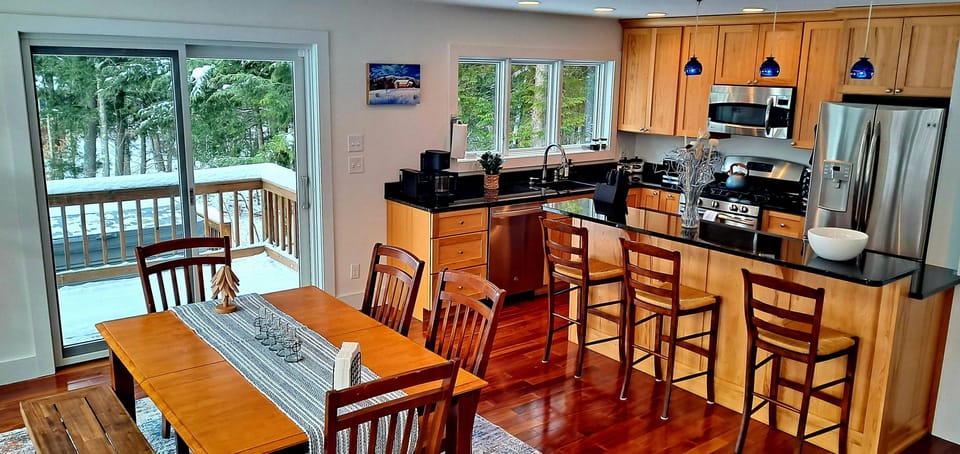 Open kitchen with island facing dining room