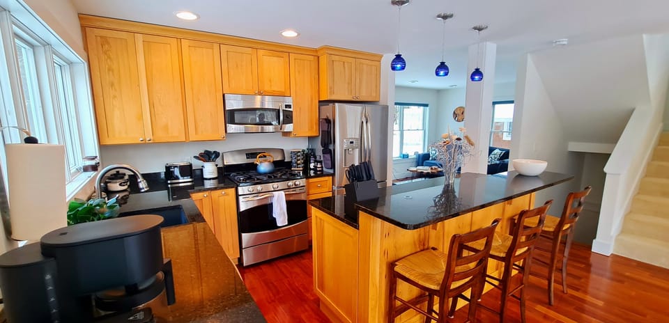 Open kitchen with island facing dining room