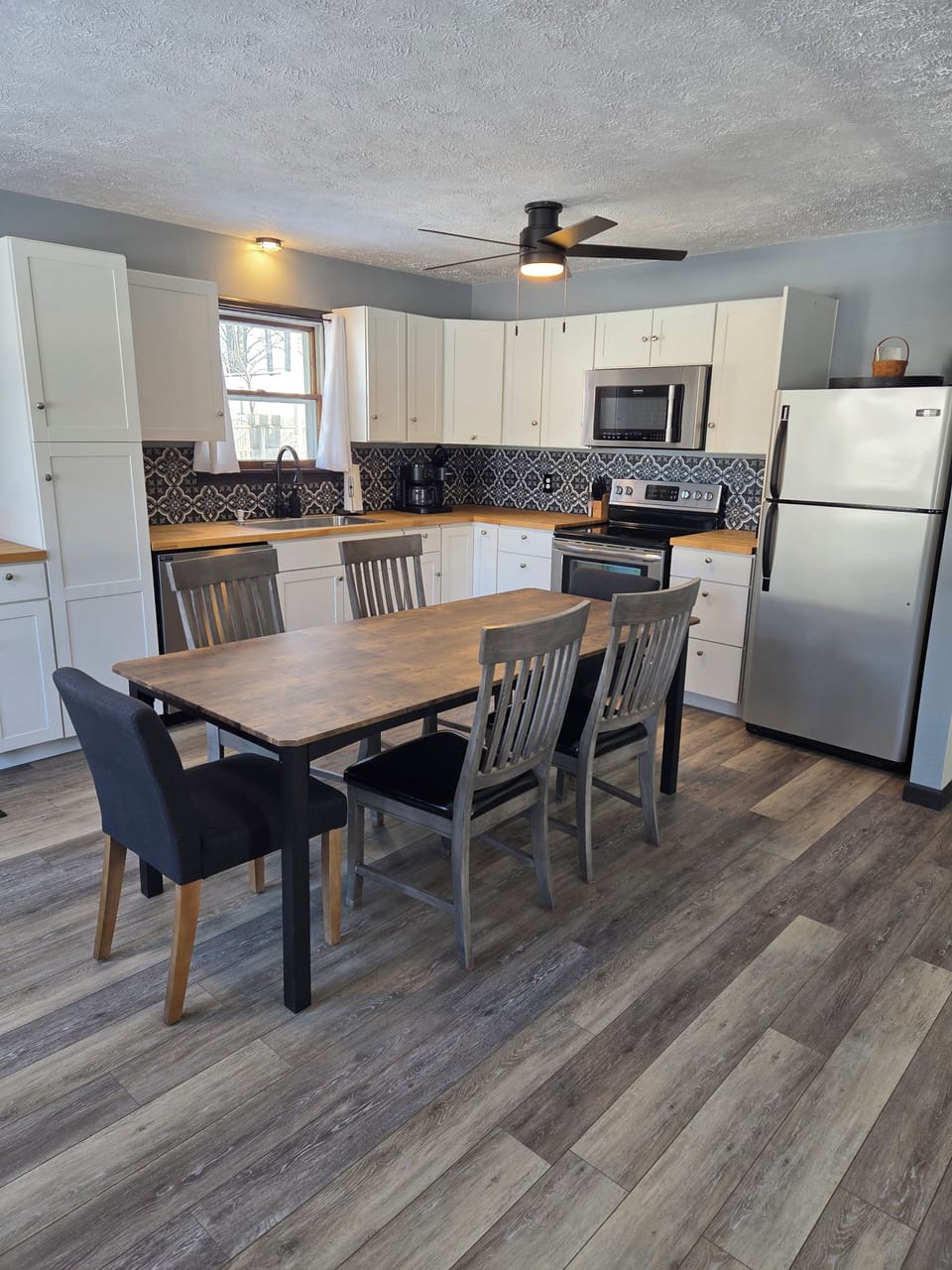 stocked kitchen with dual Keurig / brewed coffee maker. 