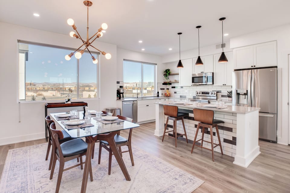 Kitchen & Dining Area | 3-Story Townhome | In-Unit Laundry