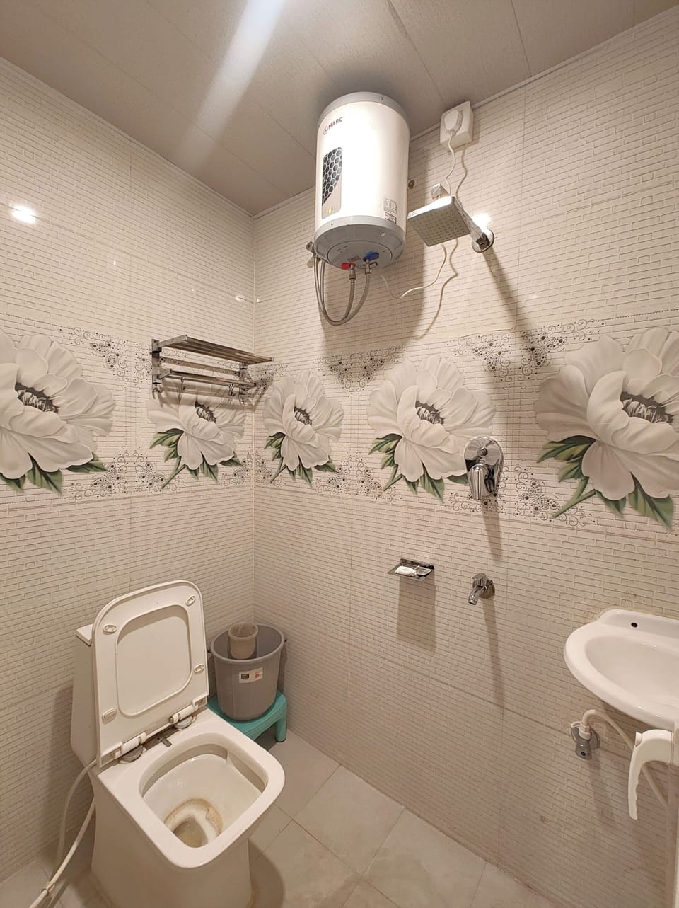 Shower, rainfall showerhead, slippers, towels