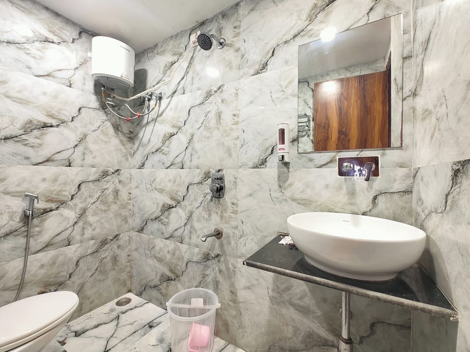 Shower, rainfall showerhead, slippers, towels