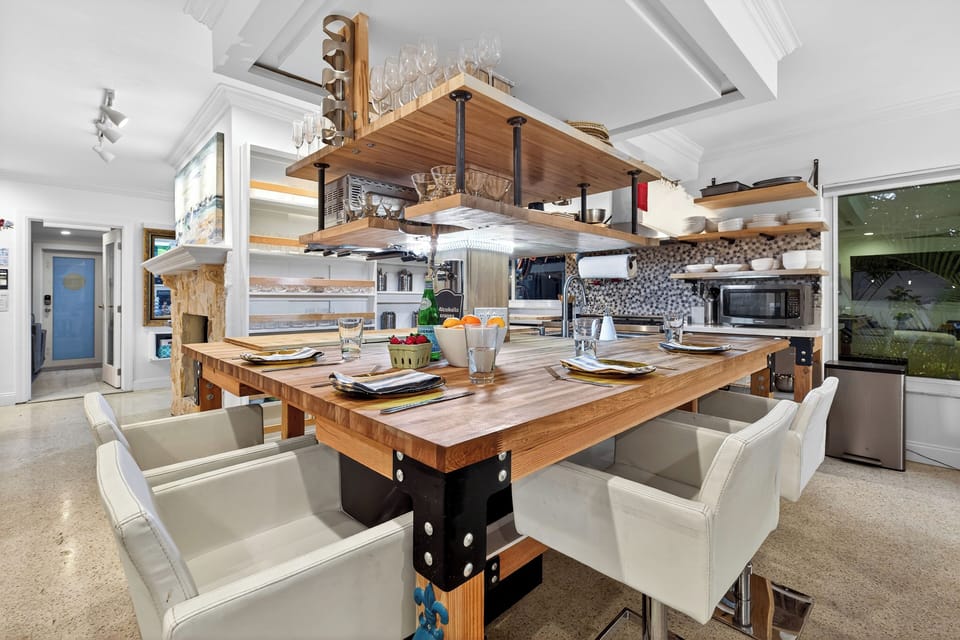 Open-concept kitchen with custom island seating and modern finishes.