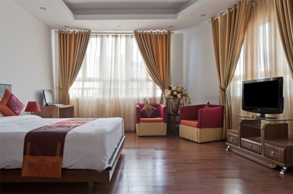 Junior Double Room, City View | Minibar, in-room safe, desk, iron/ironing board