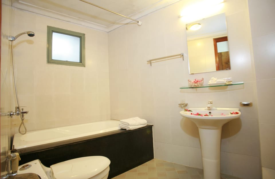 Shower, free toiletries, hair dryer, slippers