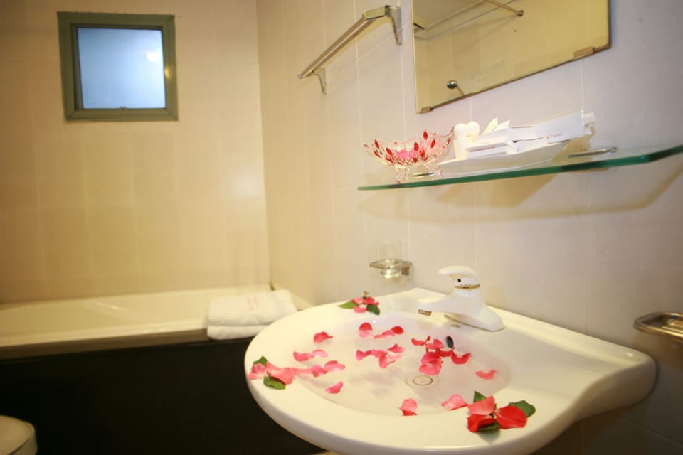 Premium Triple Room, City View | Bathroom | Shower, free toiletries, hair dryer, slippers