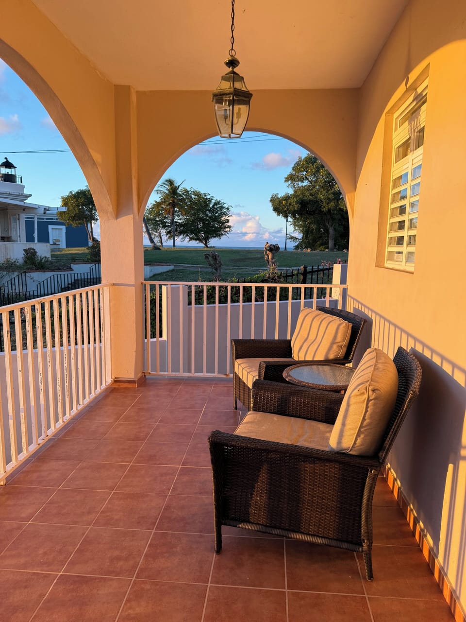 Terrace beside the lighthouse grounds with ocean views on each side