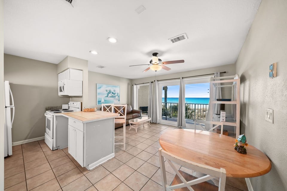 Open-concept living area with ocean views and a modern kitchen.