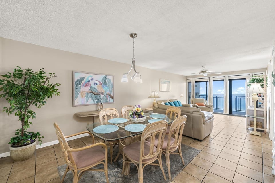 Open living and dining area with ocean views and natural light
