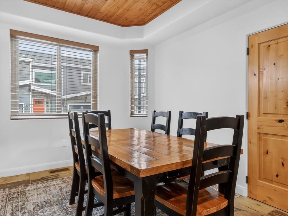 Gather around this rustic wooden table where your group can share meals and create lasting memories together.
