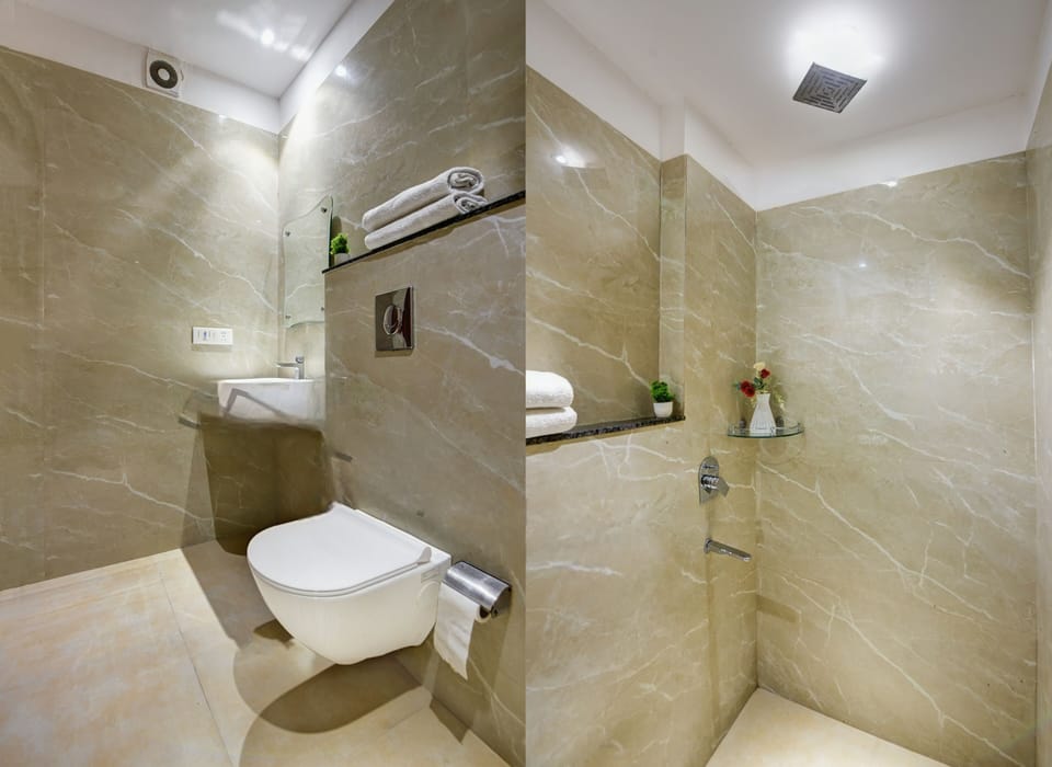 Shower, designer toiletries, slippers, towels