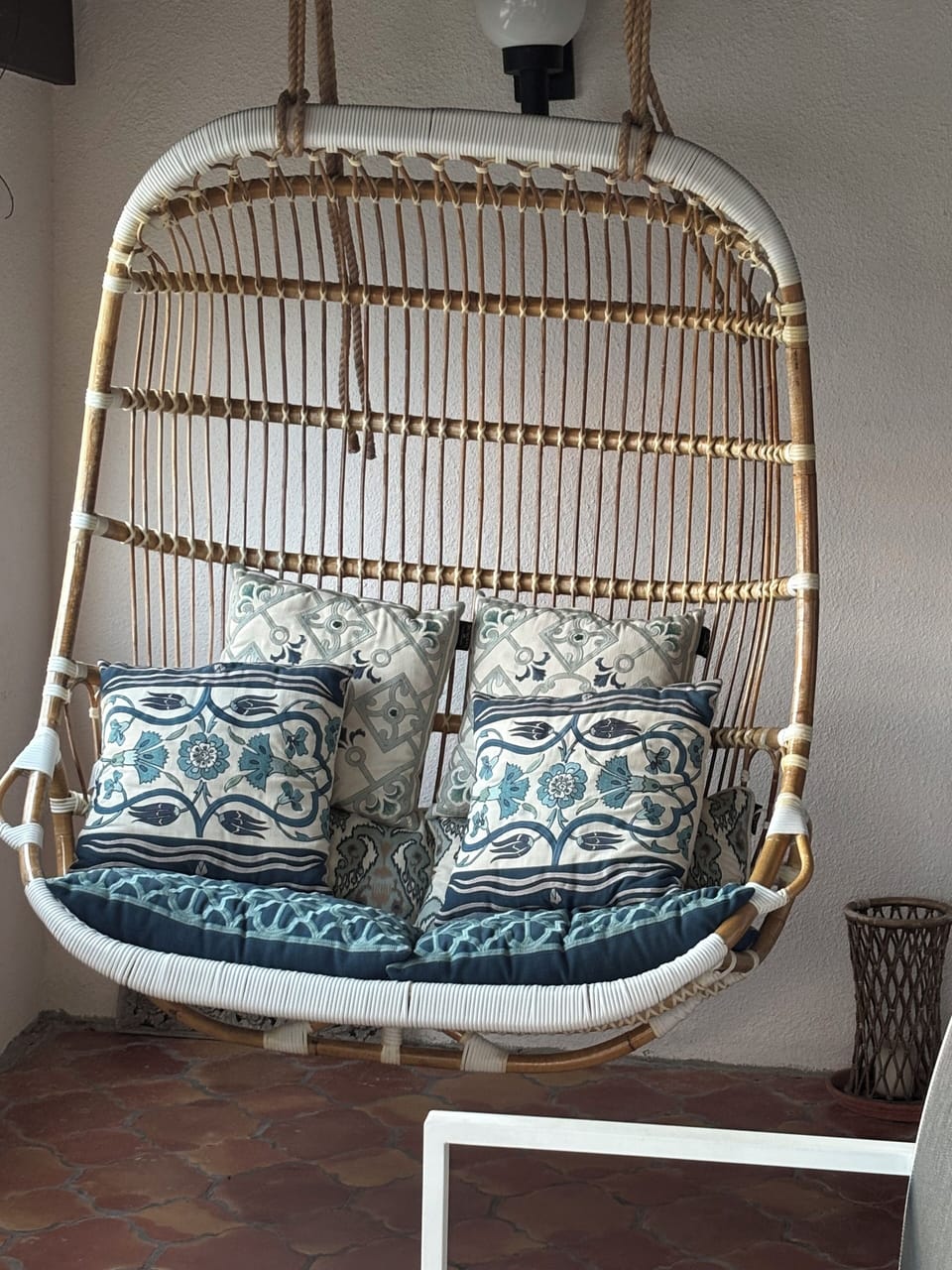 covered porch swinging chair