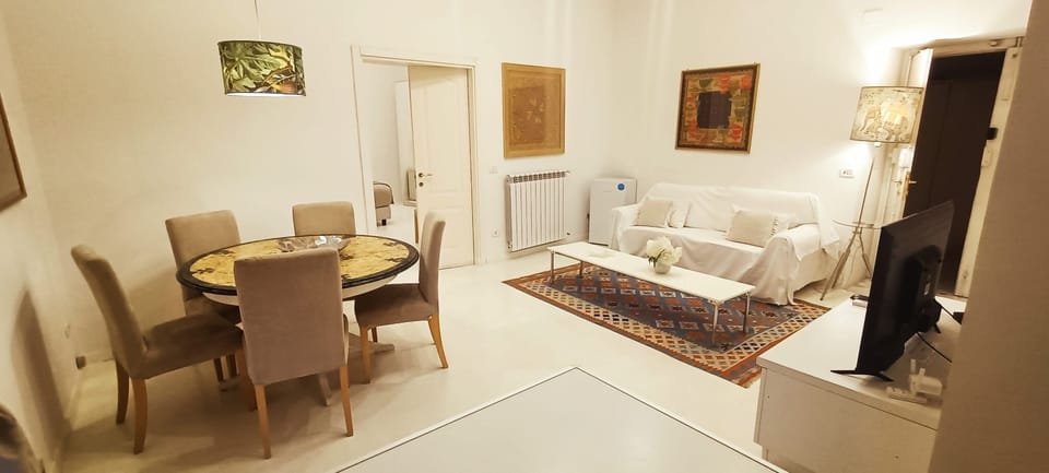 Deluxe Suite, Balcony, City View | Living area | TV