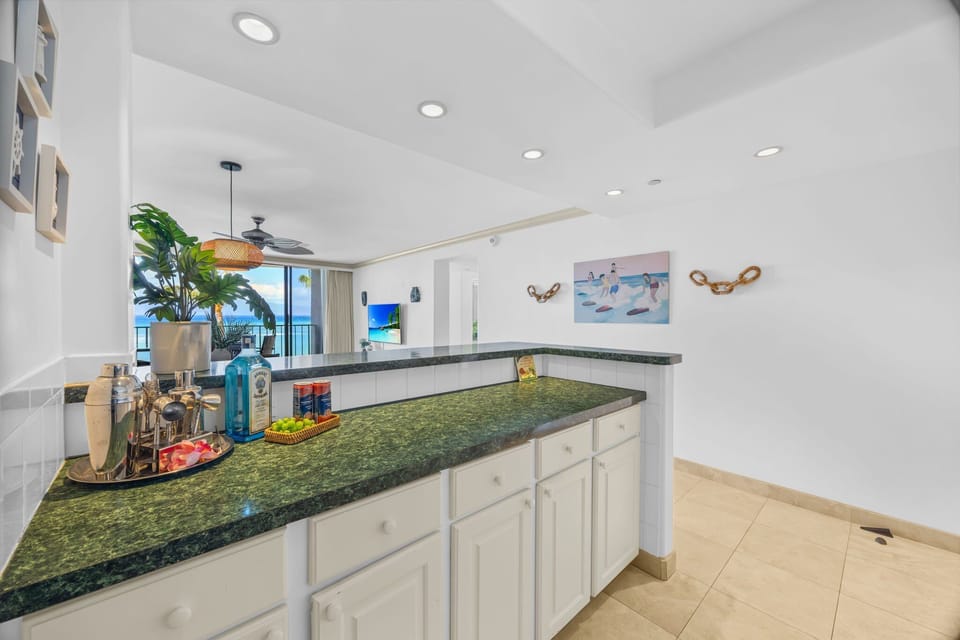 Appreciate the spacious kitchen layout with generous counter space and an open view into the living area and ocean beyond.