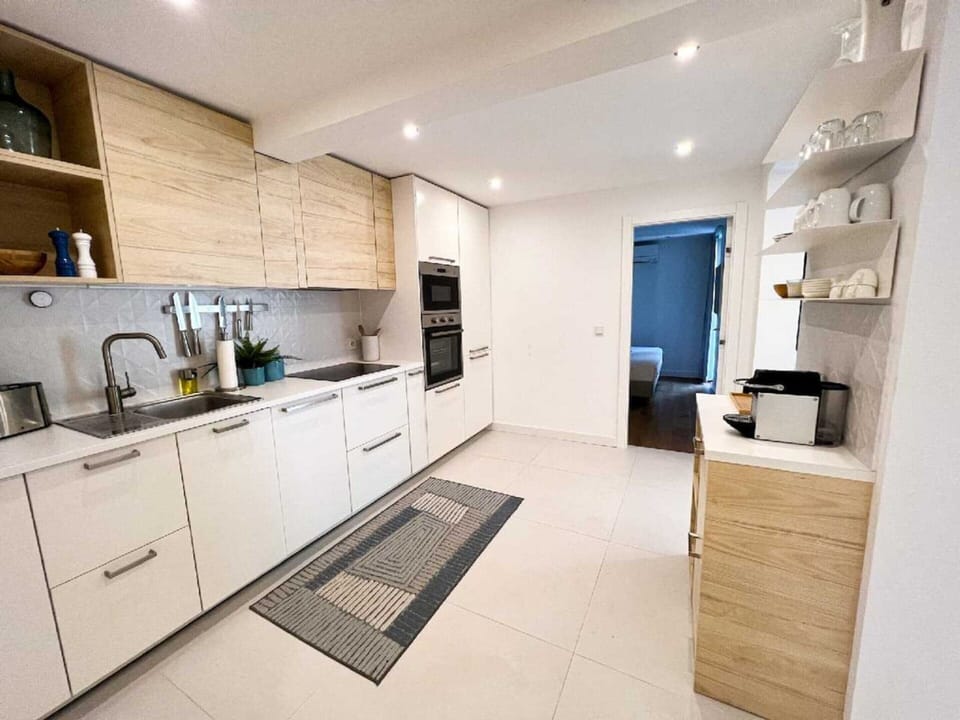 Villa | Private kitchen | Highchair, cleaning supplies