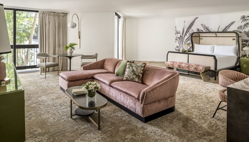Unwind in a spacious suite with plush seating and king bed.