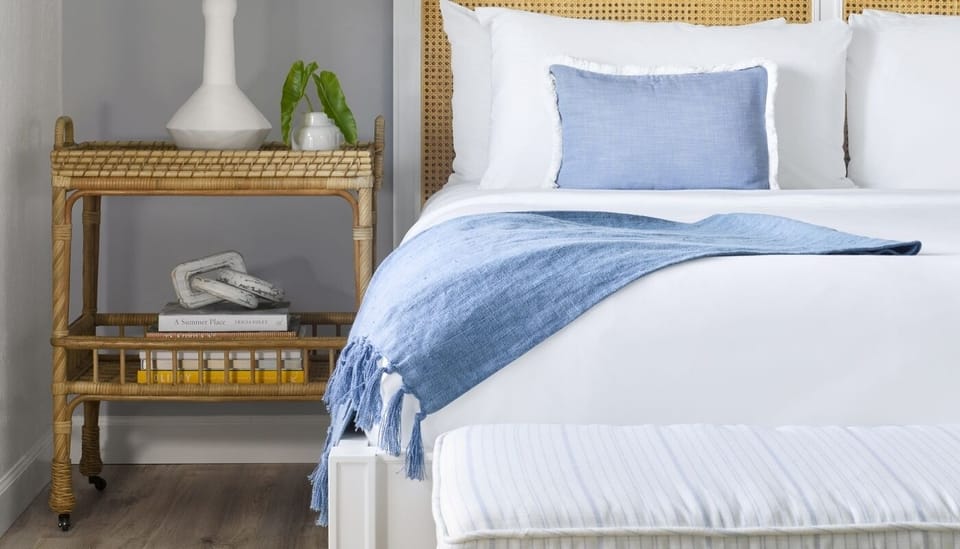 Savor boutique styling with plush pillows and cozy textures.