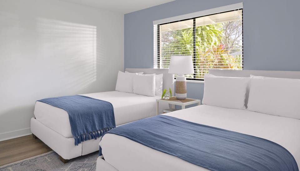 Unwind in airy twin beds with crisp linens.