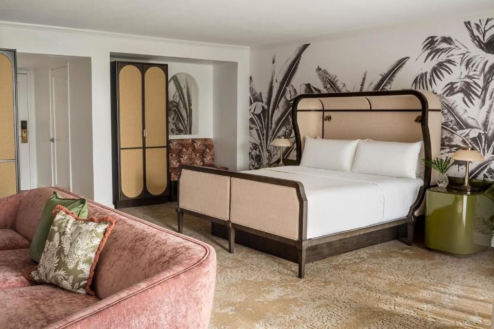 Recharge in a serene king room with statement headboard design.