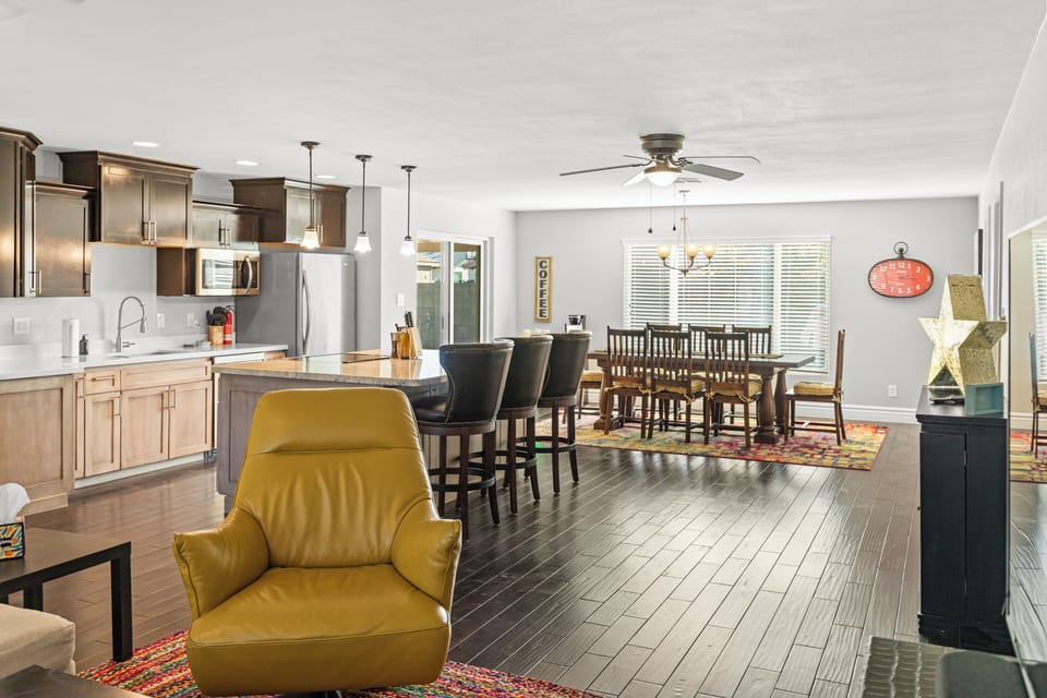 Relax in your spacious open-plan living area where the modern kitchen flows seamlessly into comfortable dining and lounge spaces.