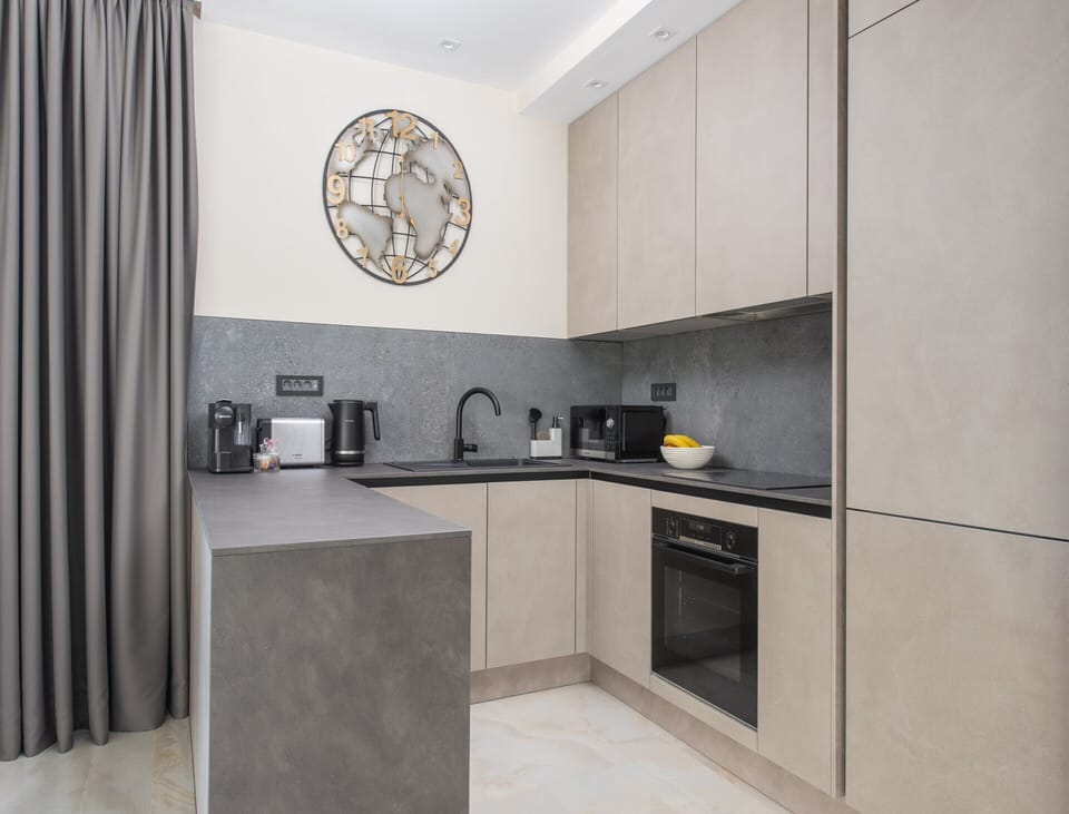 Villa | Private kitchen | Highchair, cleaning supplies