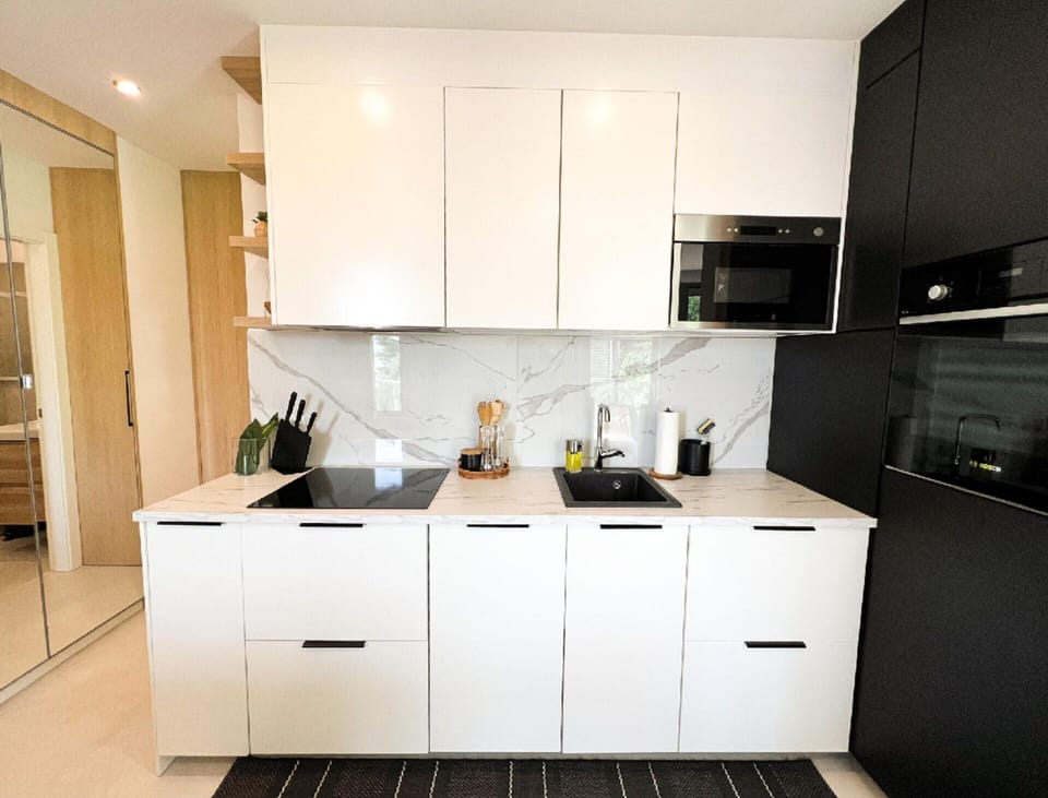 Villa | Private kitchen | Highchair, cleaning supplies