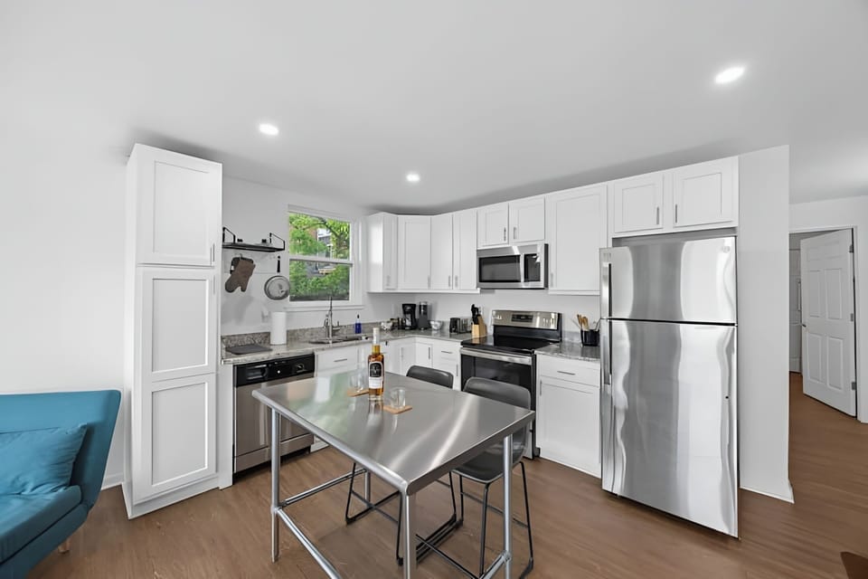 Whip up your favorite snacks in this sleek kitchen featuring stainless steel appliances.