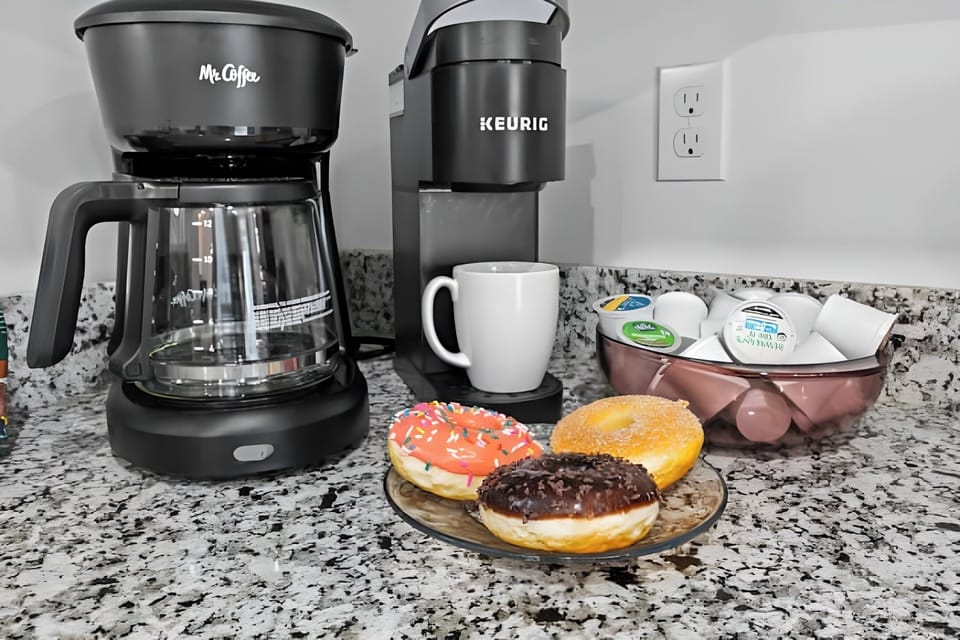 Dual coffee station with both Keurig and drip coffee makers.