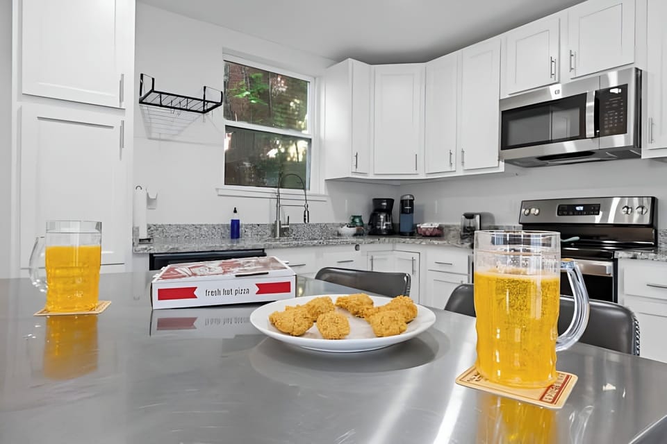 Enjoy snacks and drinks at the kitchen island perfect for happy hour.