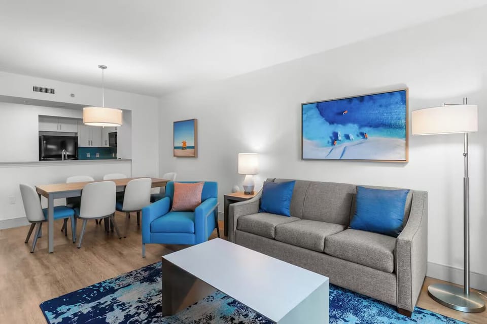 Gather on the comfy sofa in a bright, stylish living space.