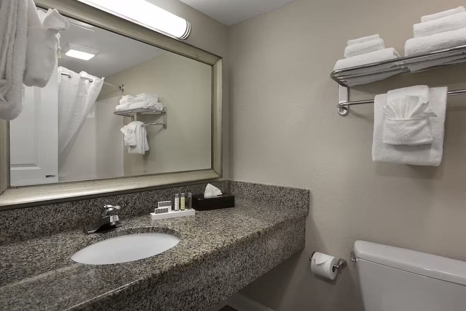Refresh easily with bright vanity, plush towels, and essentials.