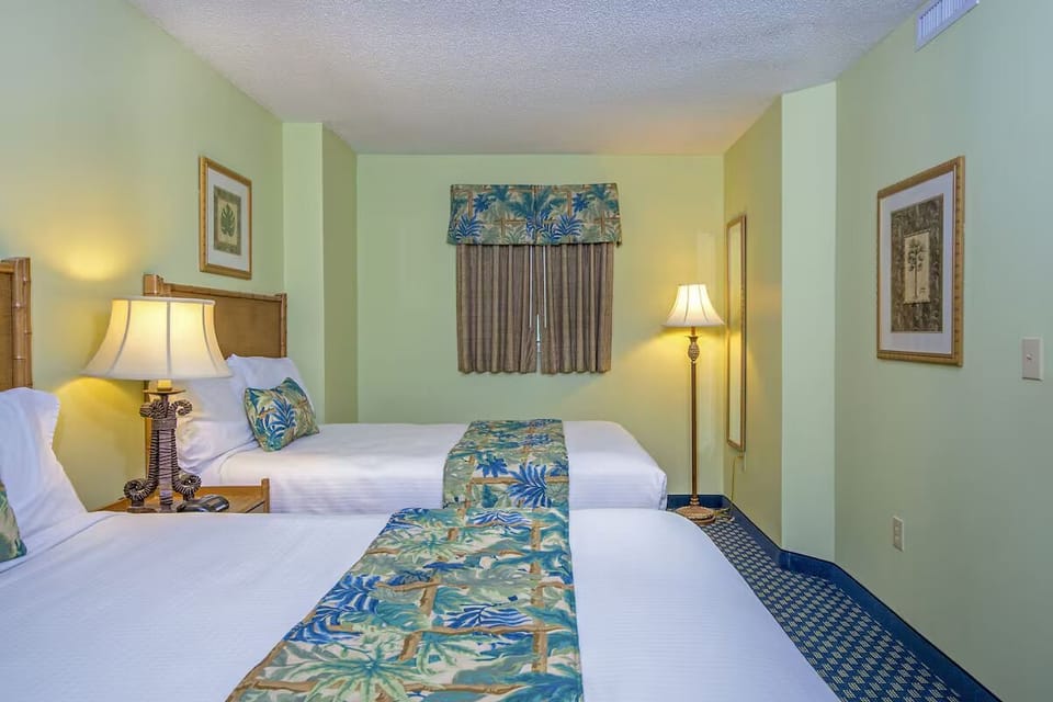 Settle in comfortably with two beds and cozy tropical styling.