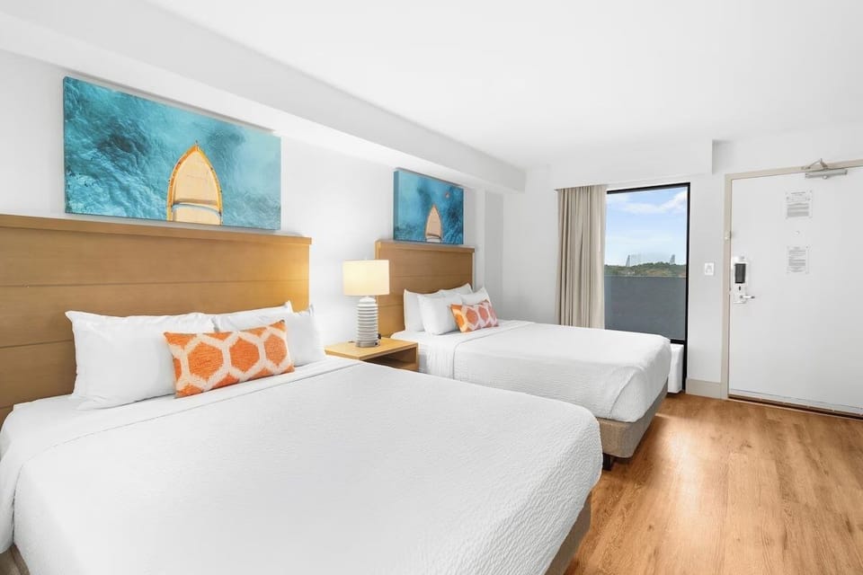 Stretch out across two plush beds after beach days.