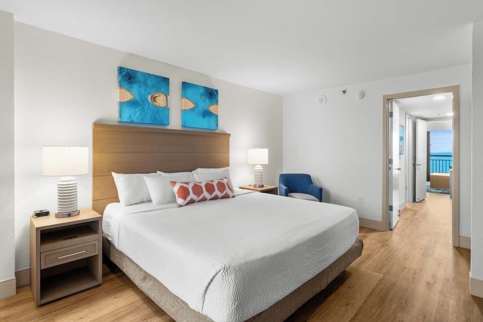 Wake up to ocean horizons from your serene king retreat.