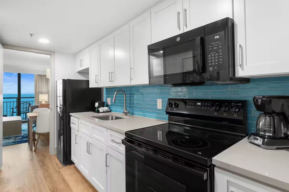 Cook easy meals in the sleek kitchen with ocean glimpses.