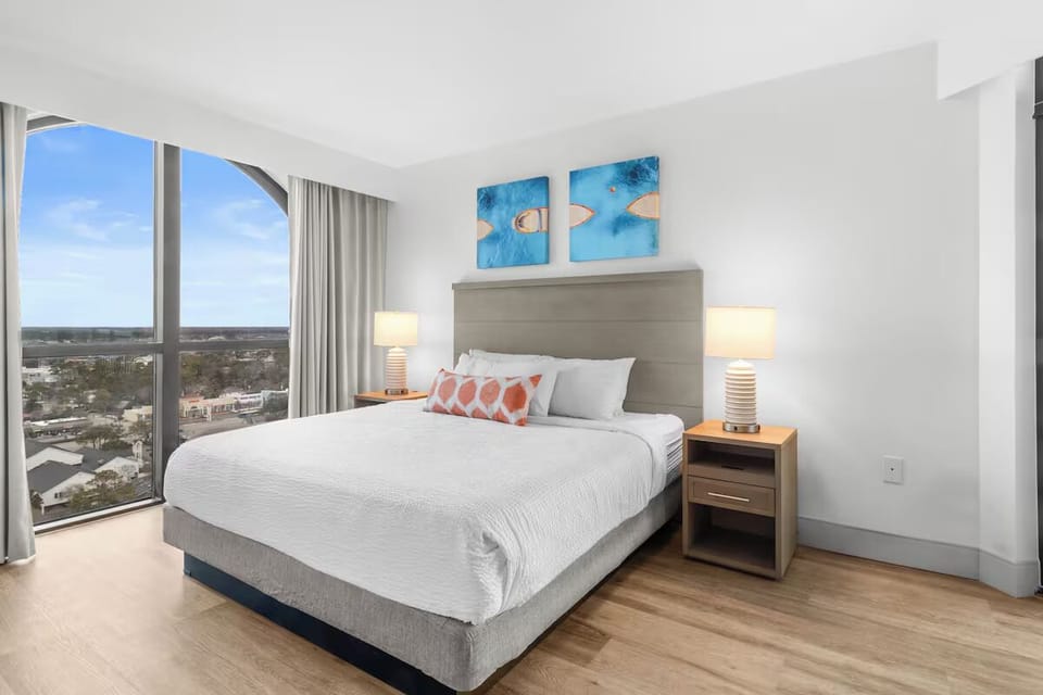 Wake up to sunlit comfort and sweeping skyline views.