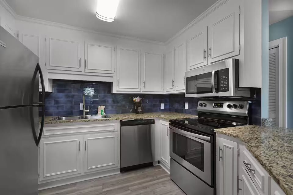 Cook with ease in a sparkling kitchen with granite counters.