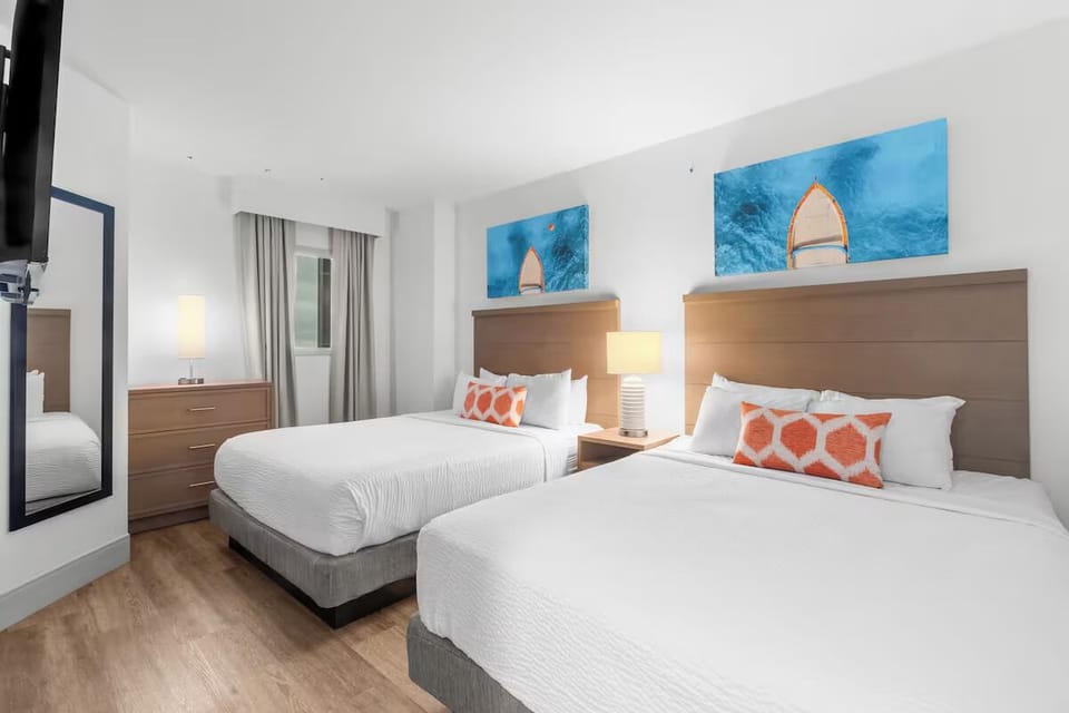 Settle into crisp linens with two cozy queen beds.