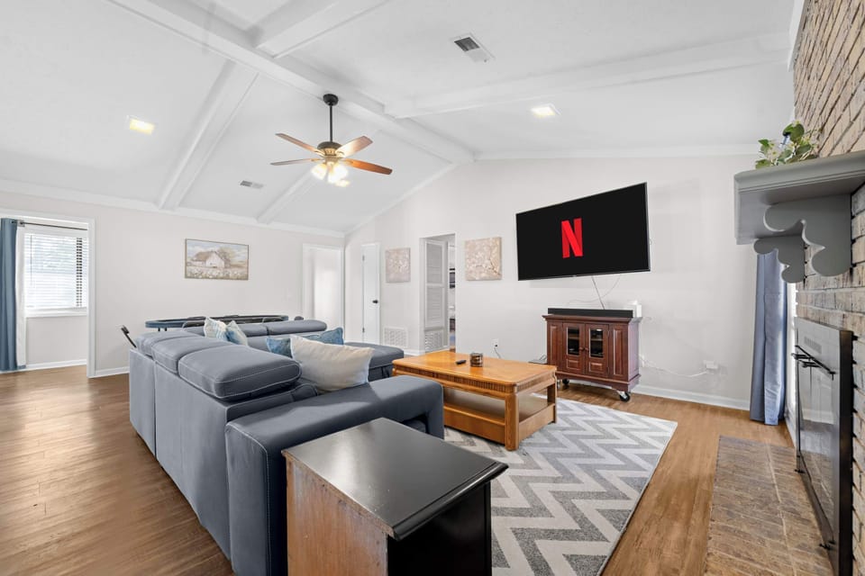 Welcome to your spacious living room with smart TV, and comfortable seating!