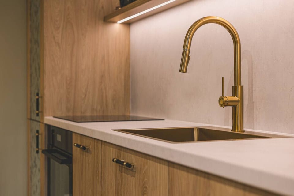 Designer gold faucet in a stylish kitchen – eye-catching detail.