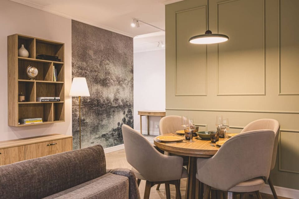 Dining space with elegant table and moody backdrop – perfect for shared moments.
