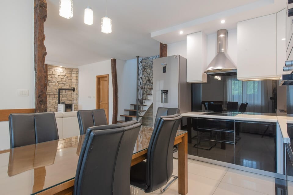 Villa | Private kitchen | Highchair, cleaning supplies