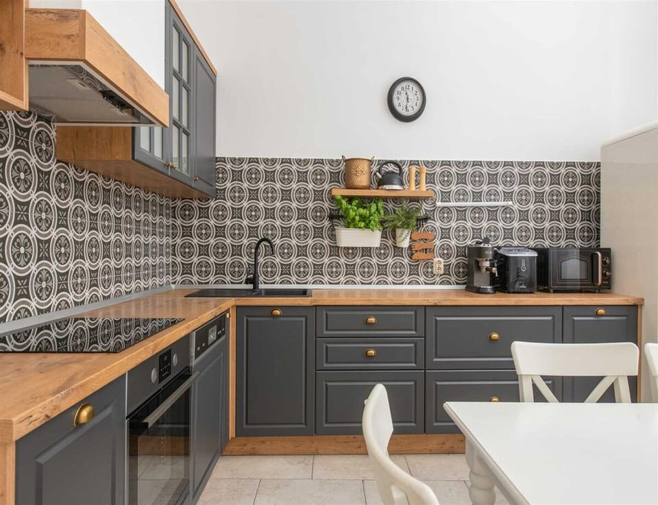 Villa | Private kitchen | Highchair, cleaning supplies