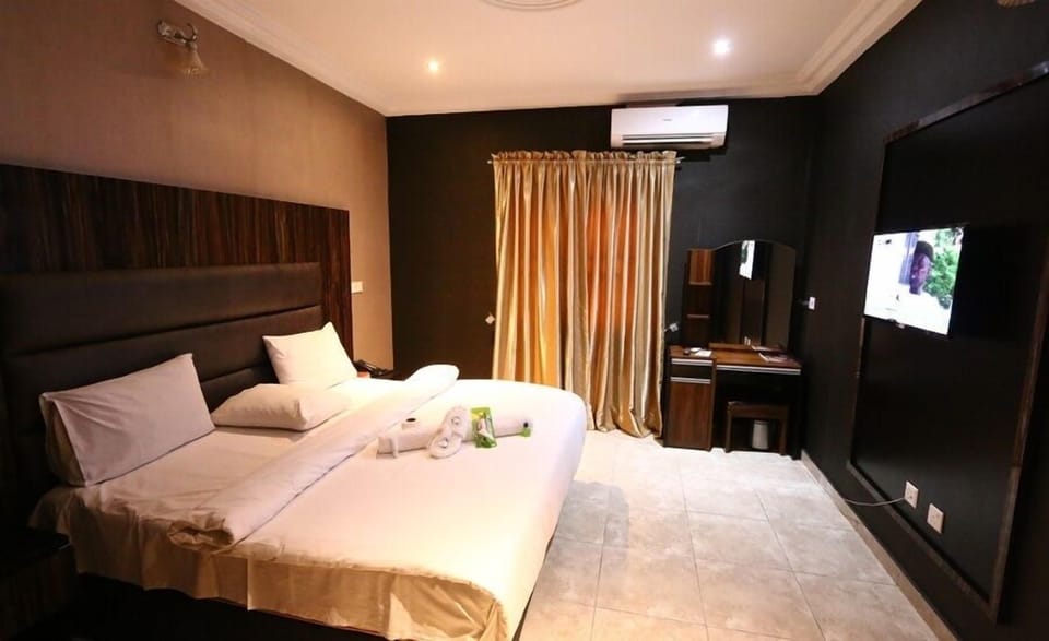 Deluxe Room, Balcony, City View | In-room safe, desk, laptop workspace, blackout drapes