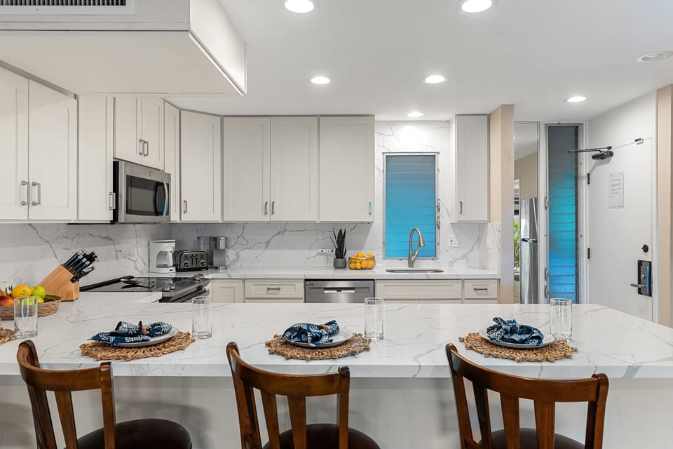 Contemporary dining space with a sleek table, cushioned chairs, and modern lighting for a welcoming atmosphere.