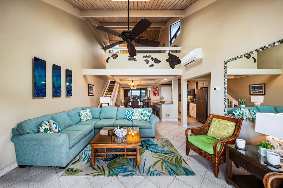 Open-concept living room with sleeper sofa and high ceilings, perfect for family gatherings