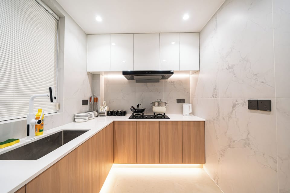 Deluxe Apartment | Private kitchen | Full-size fridge, stovetop, cookware/dishes/utensils, cleaning supplies