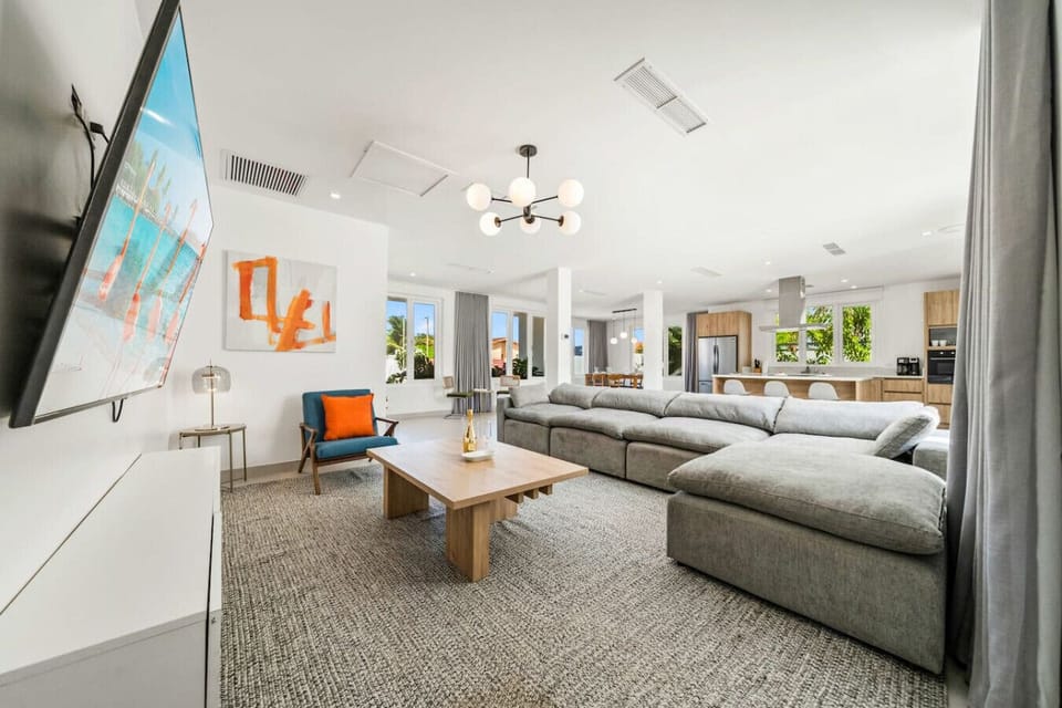 Spacious living room with plush seating for relaxing after Aruba adventures