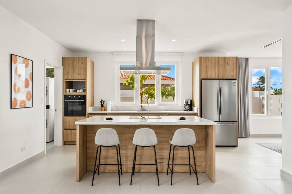 Fully equipped kitchen with island and sunny Palm Beach views